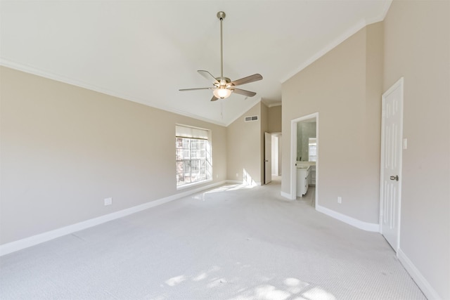 unfurnished bedroom with light carpet, visible vents, crown molding, and baseboards