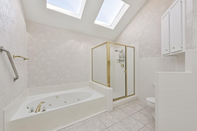 bathroom with a tub with jets, wallpapered walls, a shower stall, vaulted ceiling, and tile patterned floors