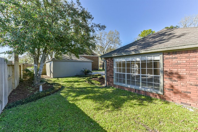 view of yard featuring an outbuilding and a fenced backyard