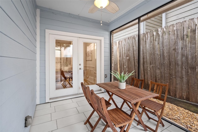 sunroom featuring french doors and ceiling fan