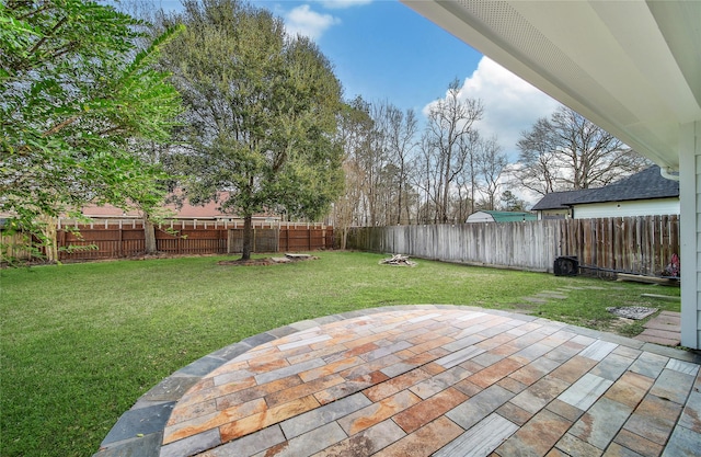 view of yard with a fenced backyard and a patio