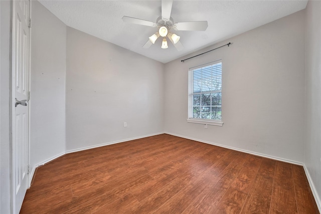 unfurnished room with ceiling fan, baseboards, and wood finished floors