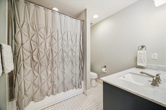 bathroom with vanity, shower / tub combo, toilet, and recessed lighting