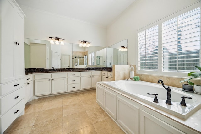 bathroom with vanity, a garden tub, a stall shower, ornamental molding, and tile patterned floors