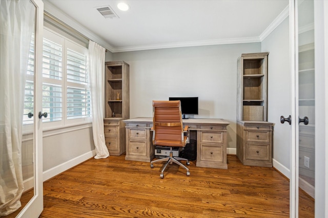 home office featuring visible vents, crown molding, baseboards, french doors, and wood finished floors