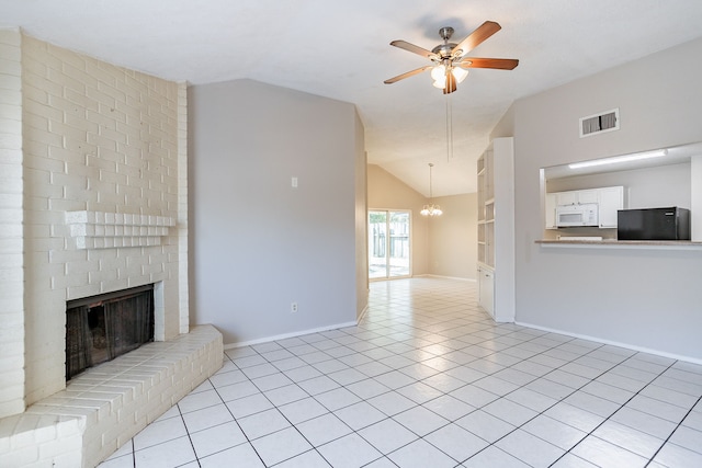 living area featuring light tile patterned floors, visible vents, a fireplace, vaulted ceiling, and ceiling fan with notable chandelier