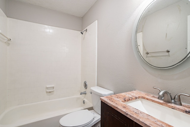 bathroom with toilet, shower / tub combination, vanity, a textured wall, and a textured ceiling