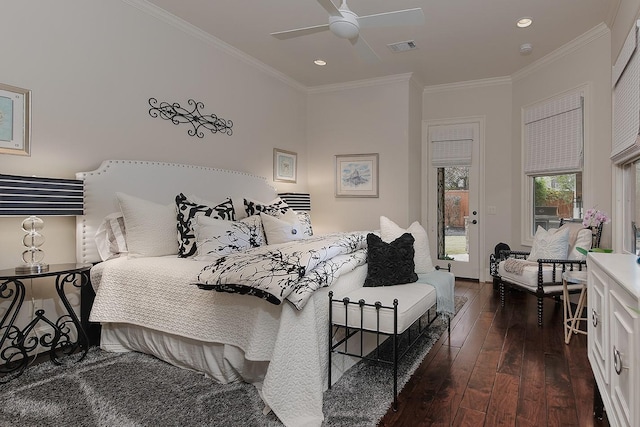 bedroom featuring dark wood finished floors, crown molding, recessed lighting, and visible vents