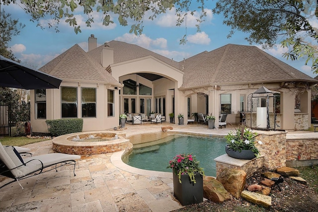 pool featuring outdoor lounge area, a patio, and fence