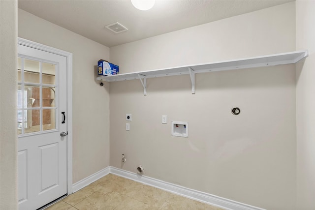 clothes washing area with baseboards, gas dryer hookup, washer hookup, laundry area, and electric dryer hookup