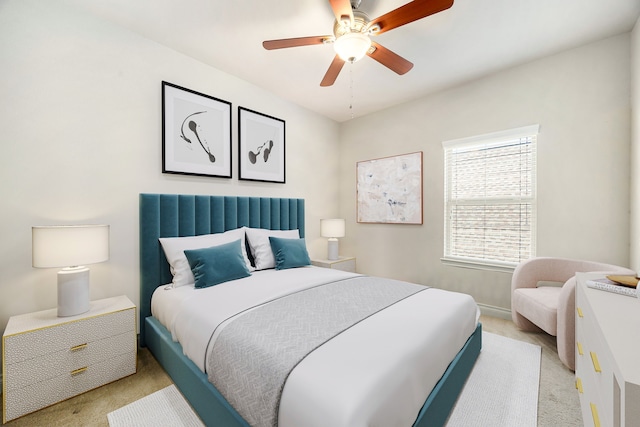 bedroom with baseboards, light carpet, and a ceiling fan