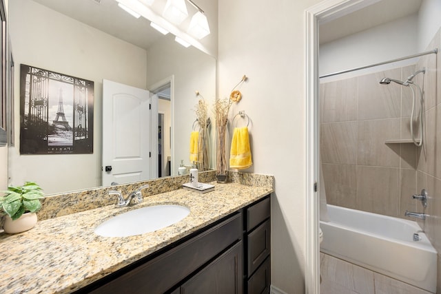 bathroom with toilet, vanity, and  shower combination