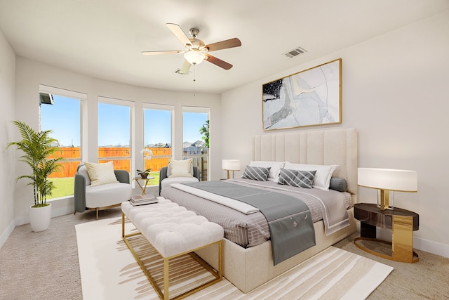 bedroom with visible vents, carpet floors, baseboards, and access to outside