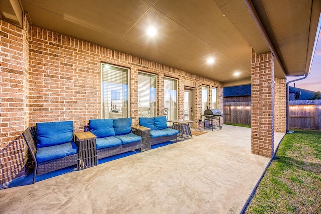 view of patio with a grill, fence, and an outdoor hangout area