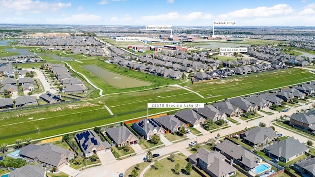 birds eye view of property with a residential view and a water view