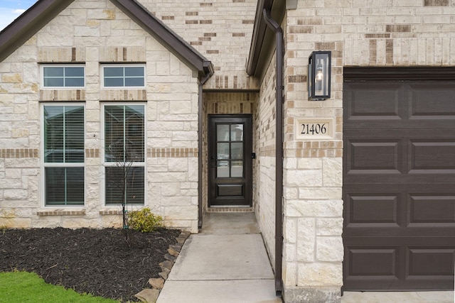 view of exterior entry featuring stone siding