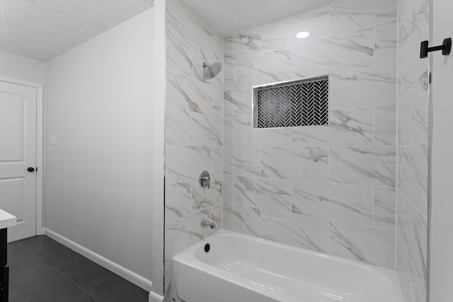 full bath with tub / shower combination, a textured ceiling, vanity, and baseboards