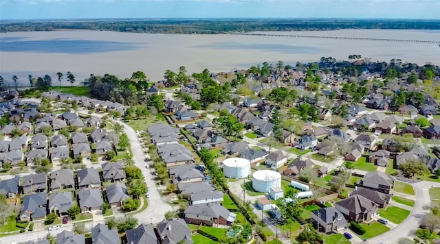 bird's eye view featuring a residential view and a water view