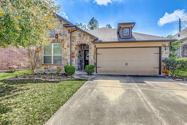 view of front facade with stone siding, driveway, an attached garage, and a front lawn