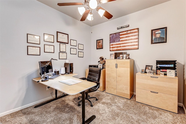 office with light colored carpet, baseboards, and ceiling fan