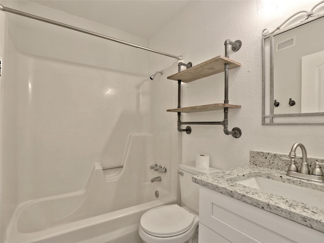 bathroom featuring toilet, visible vents, vanity, shower / washtub combination, and a textured wall