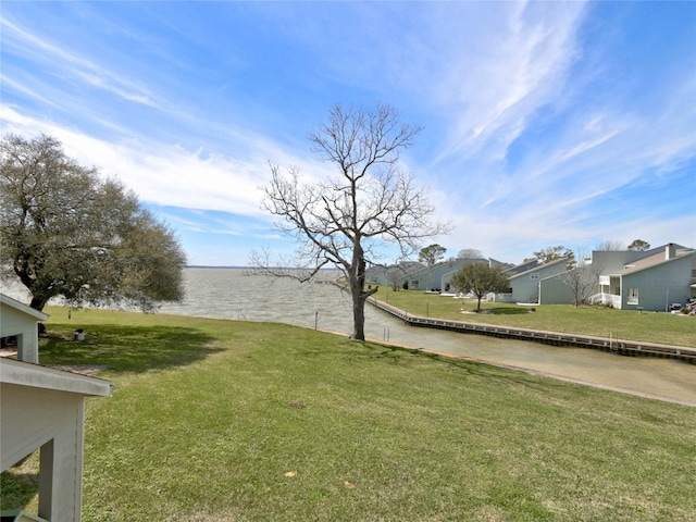 view of yard featuring a water view and a residential view