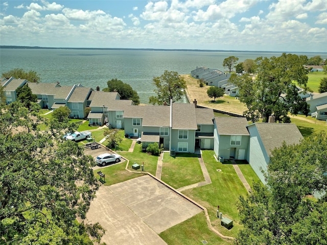 drone / aerial view with a water view and a residential view