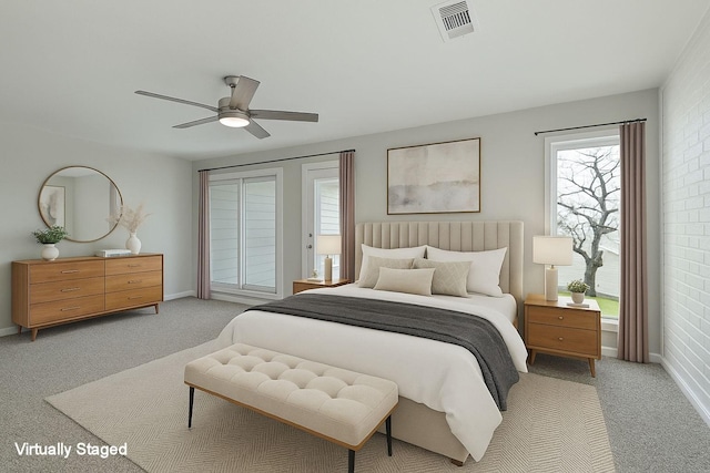 bedroom featuring baseboards, light carpet, access to outside, and visible vents