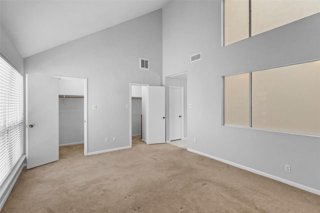 unfurnished bedroom featuring visible vents, carpet flooring, and baseboards