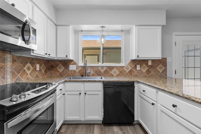 kitchen with decorative backsplash, appliances with stainless steel finishes, dark wood-style floors, white cabinetry, and a sink