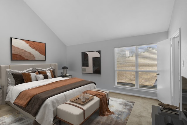 bedroom featuring carpet flooring, baseboards, and vaulted ceiling