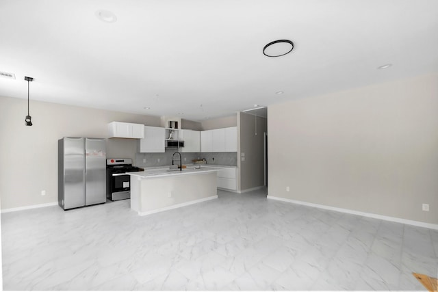 kitchen with stainless steel appliances, light countertops, white cabinets, marble finish floor, and open floor plan