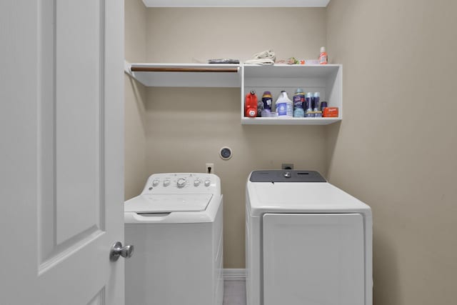 laundry room with washer and clothes dryer and laundry area