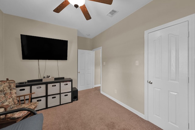 sitting room with visible vents, ceiling fan, baseboards, and carpet