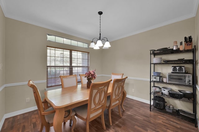 dining space with baseboards, an inviting chandelier, dark wood-style floors, and ornamental molding