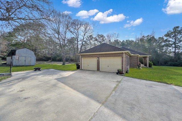 view of side of property with a garage, a lawn, concrete driveway, and brick siding