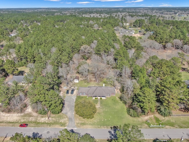 bird's eye view featuring a forest view