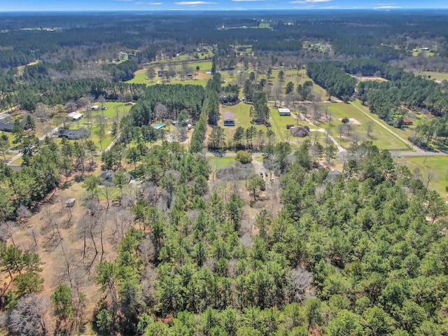 aerial view featuring a wooded view