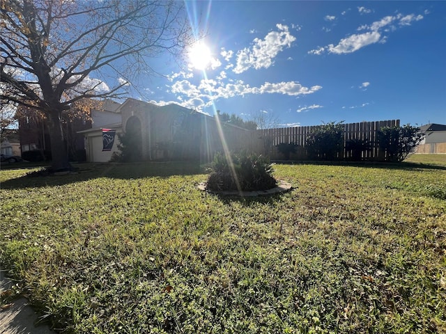 view of yard featuring fence