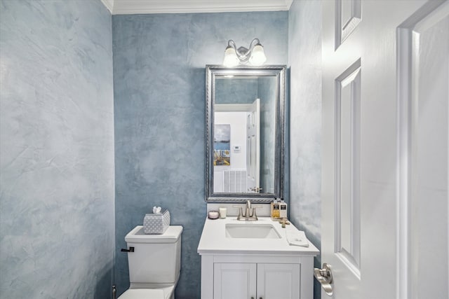 bathroom with toilet and vanity