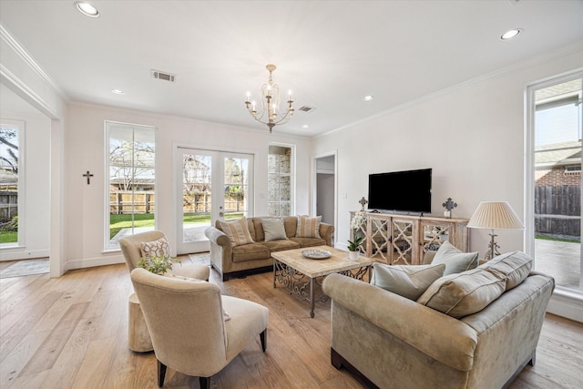 living area featuring visible vents, light wood-style flooring, recessed lighting, french doors, and a notable chandelier