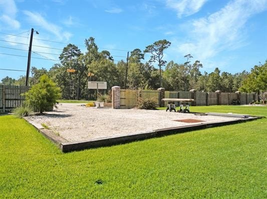 surrounding community with a lawn and fence