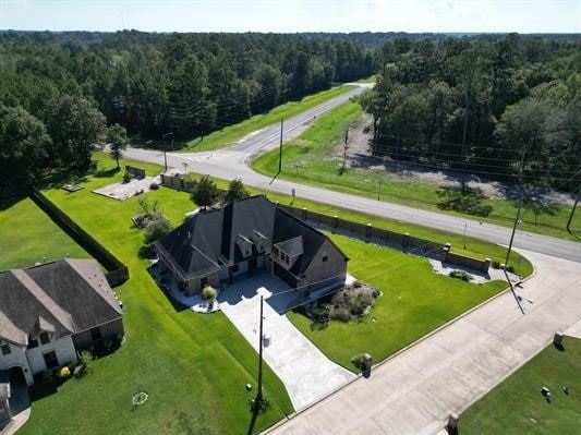 aerial view featuring a wooded view