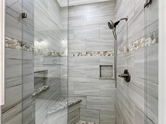 bathroom with a shower stall