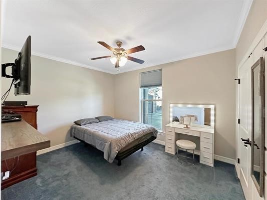 bedroom featuring baseboards, dark carpet, and crown molding