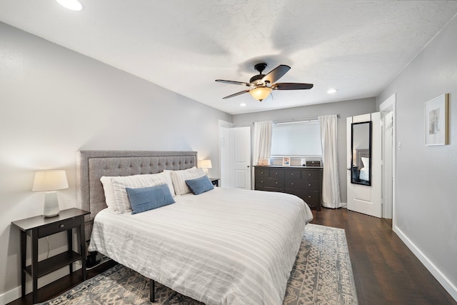 bedroom featuring recessed lighting, baseboards, dark wood finished floors, and a ceiling fan