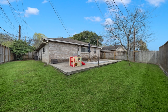 rear view of house with brick siding, central air condition unit, a yard, a fenced backyard, and a patio