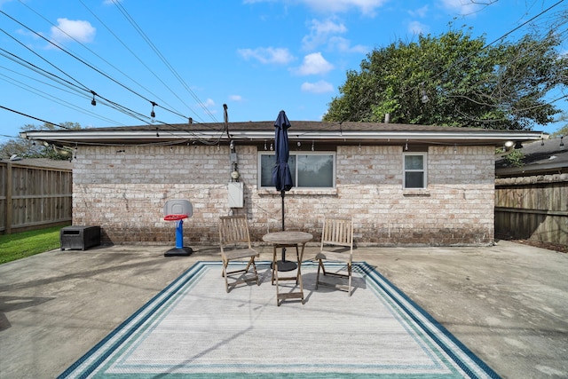 view of patio / terrace featuring fence