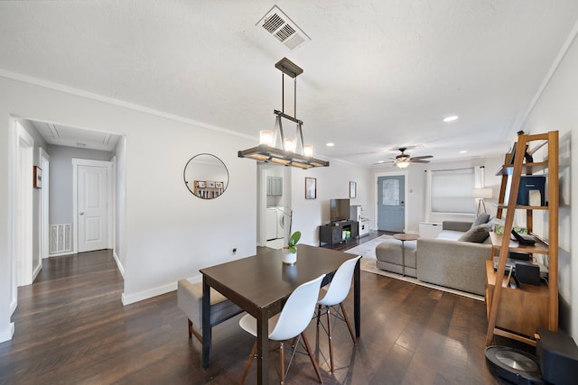 dining room featuring visible vents, attic access, ornamental molding, and a ceiling fan