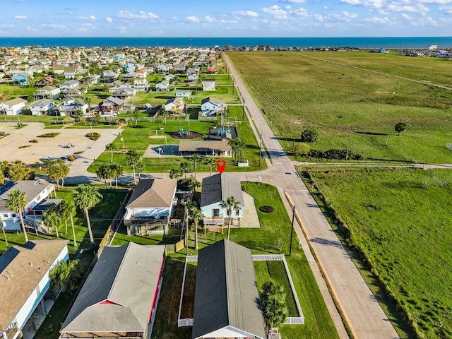 birds eye view of property with a residential view and a water view